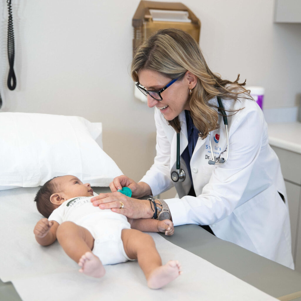 Dr. Kiesel with infant patient